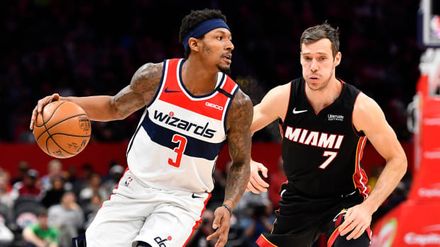 Washington Wizards guard Bradley Beal dribbles past Miami Heat guard Goran Dragic.